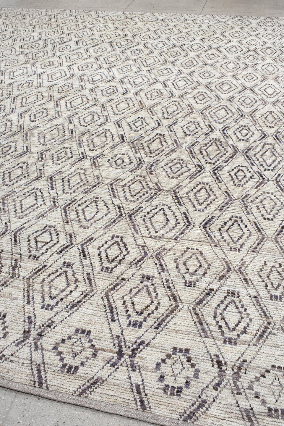 12' x 14' one-of-a-kind handmade vintage Tulu oversize rug. Color palette: ivory, charcoal, taupe, brown, gray, black, beige