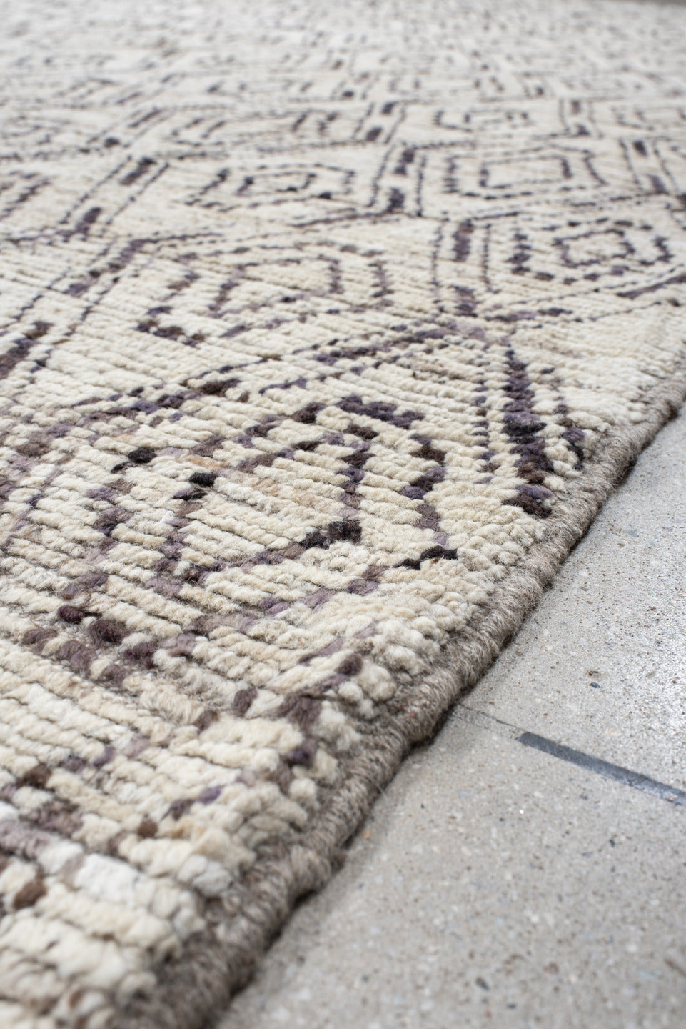 12' x 14' one-of-a-kind handmade vintage Tulu oversize rug. Color palette: ivory, charcoal, taupe, brown, gray, black, beige
