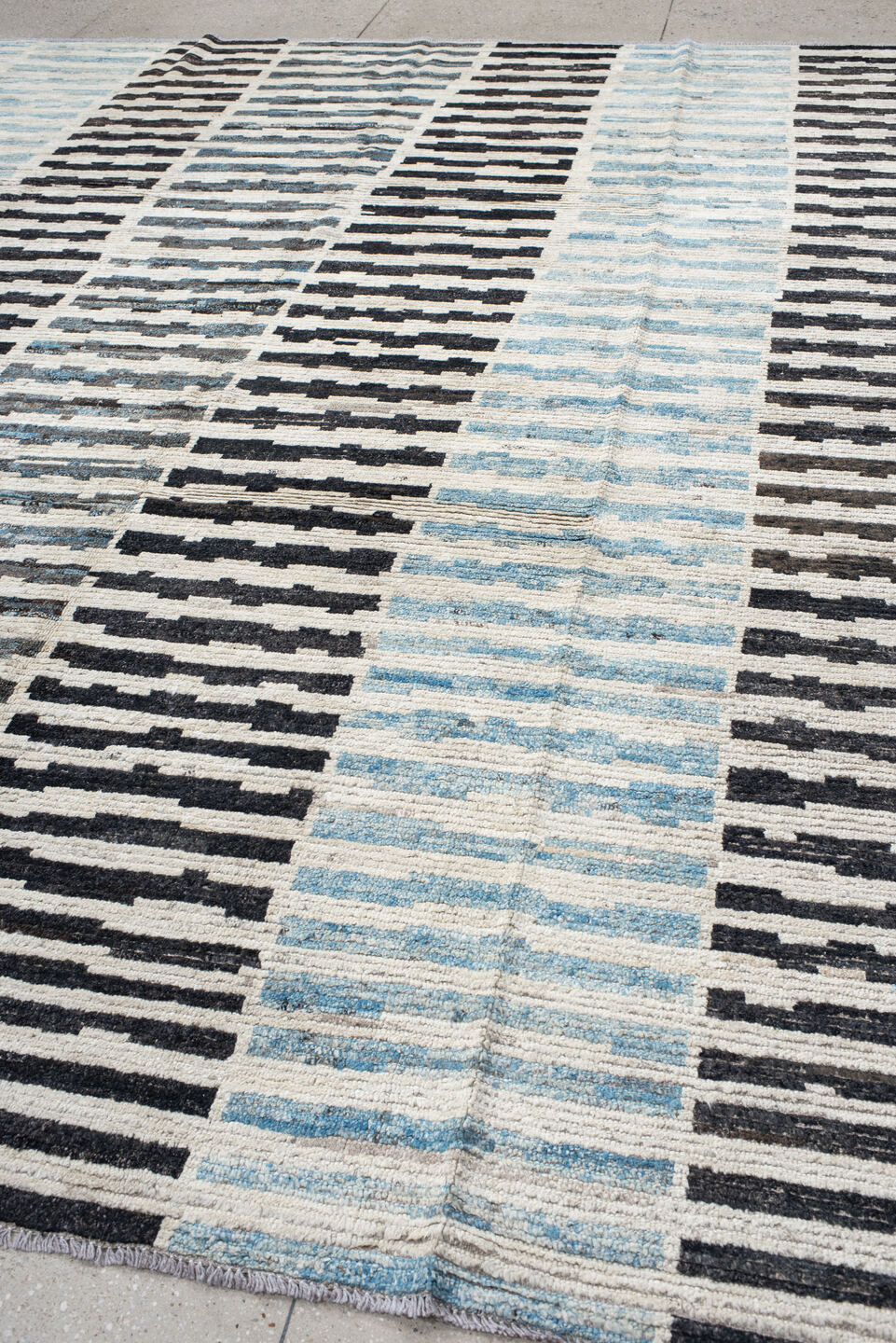 9' x 11' one-of-a-kind handmade vintage Tulu large size rug. Color palette: ivory, sky blue, charcoal, gray, black