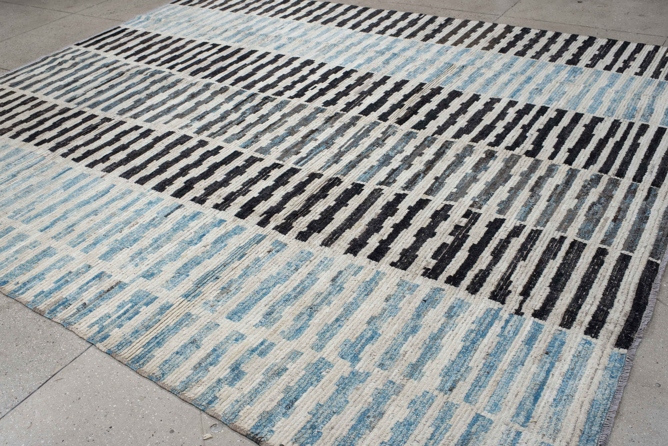 9' x 11' one-of-a-kind handmade vintage Tulu large size rug. Color palette: ivory, sky blue, charcoal, gray, black