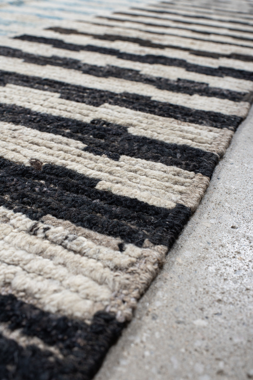 9' x 11' one-of-a-kind handmade vintage Tulu large size rug. Color palette: ivory, sky blue, charcoal, gray, black