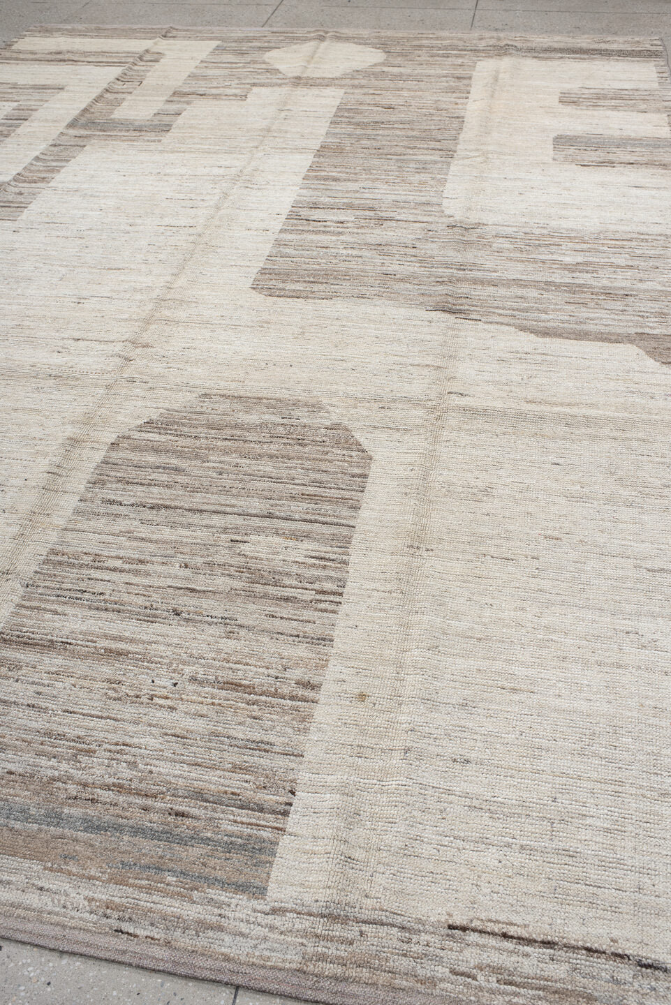 9' x 13' one-of-a-kind handmade vintage Tulu large size rug. Color palette: ivory, taupe, beige, cream, greige, stone, gray