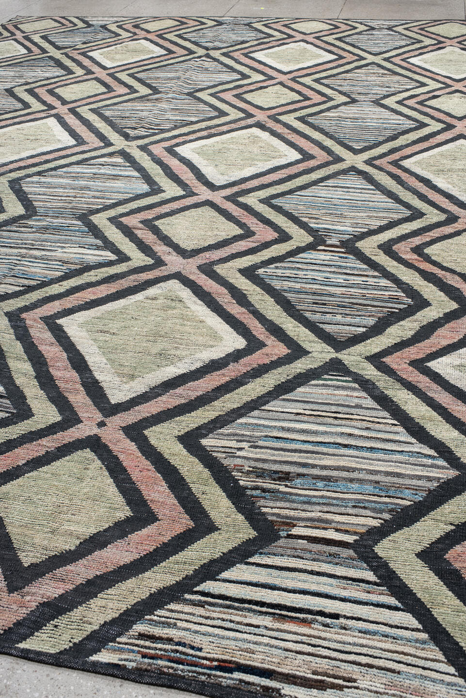 13' x 16' one-of-a-kind handmade vintage Tulu oversize rug. Color palette: ivory, charcoal, blush, pale blue, sage, taupe