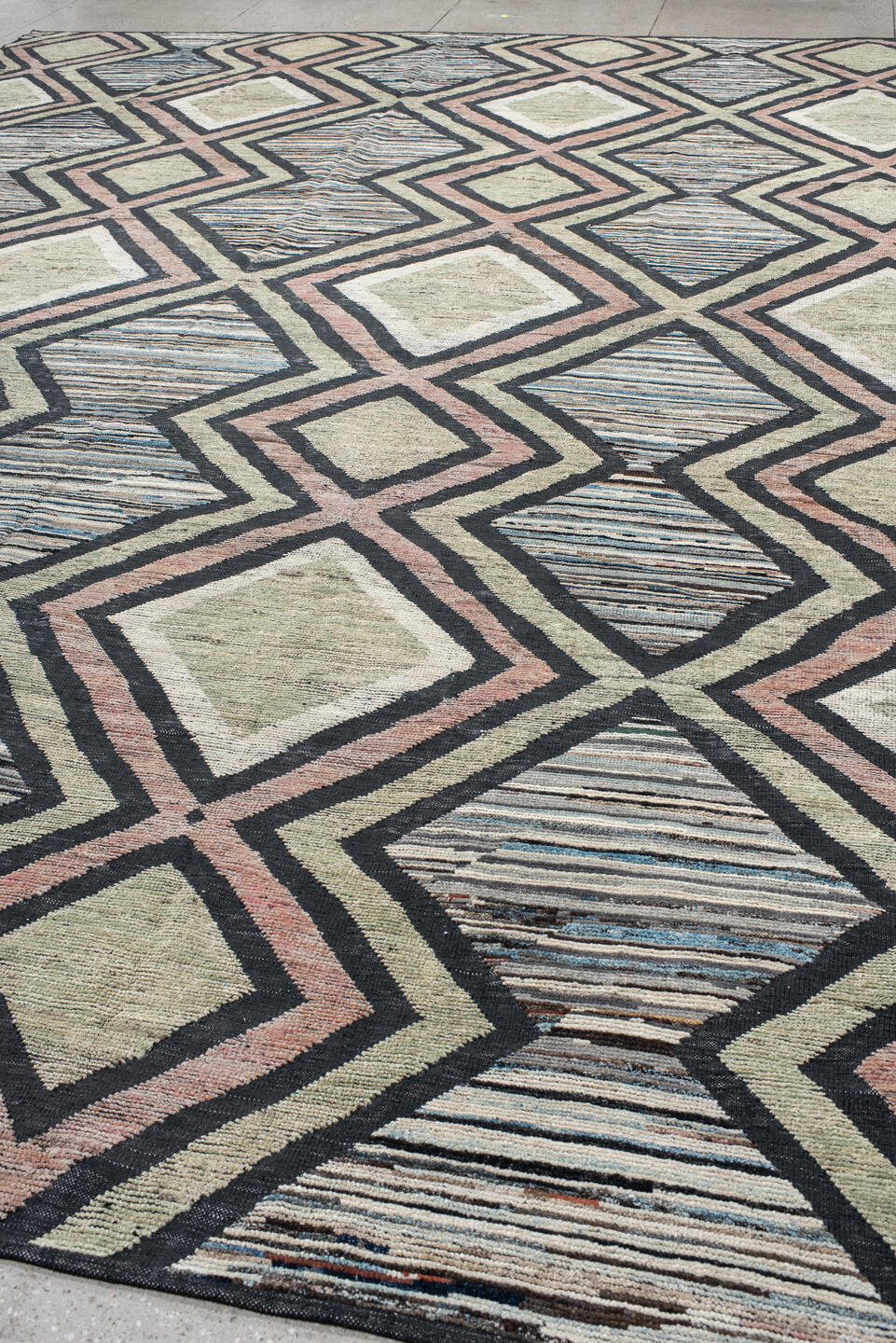 13' x 16' one-of-a-kind handmade vintage Tulu oversize rug. Color palette: ivory, charcoal, blush, pale blue, sage, taupe