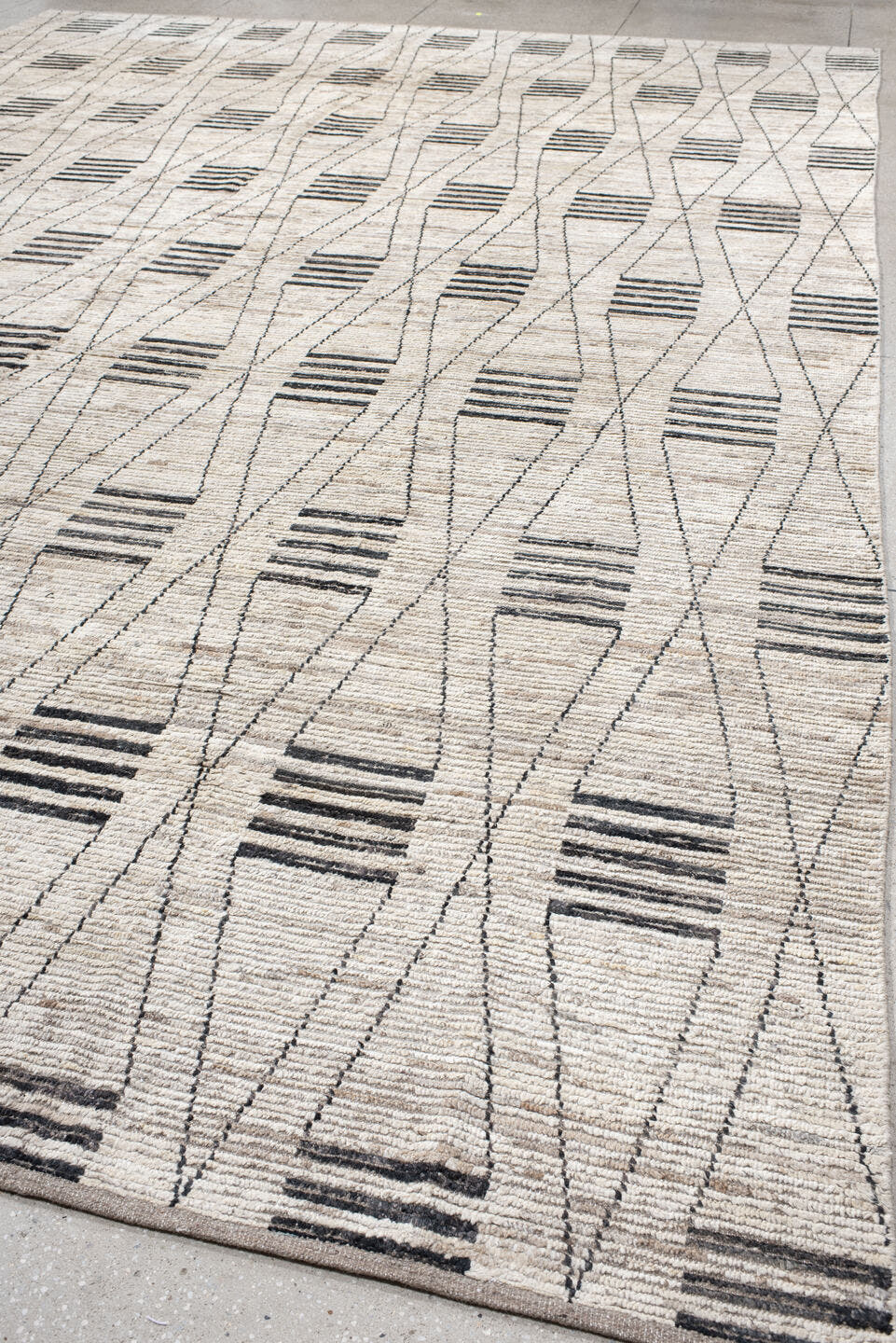 12' x 17' one-of-a-kind handmade vintage Tulu oversize rug. Color palette: ivory, charcoal, taupe, gray, black, beige