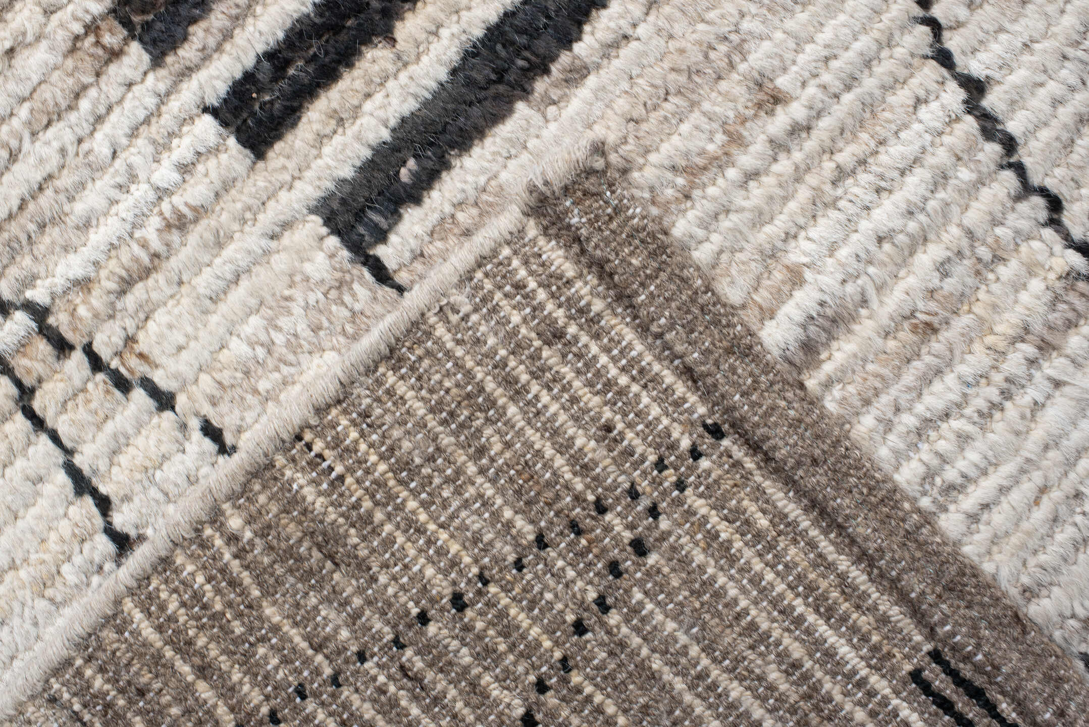 12' x 17' one-of-a-kind handmade vintage Tulu oversize rug. Color palette: ivory, charcoal, taupe, gray, black, beige