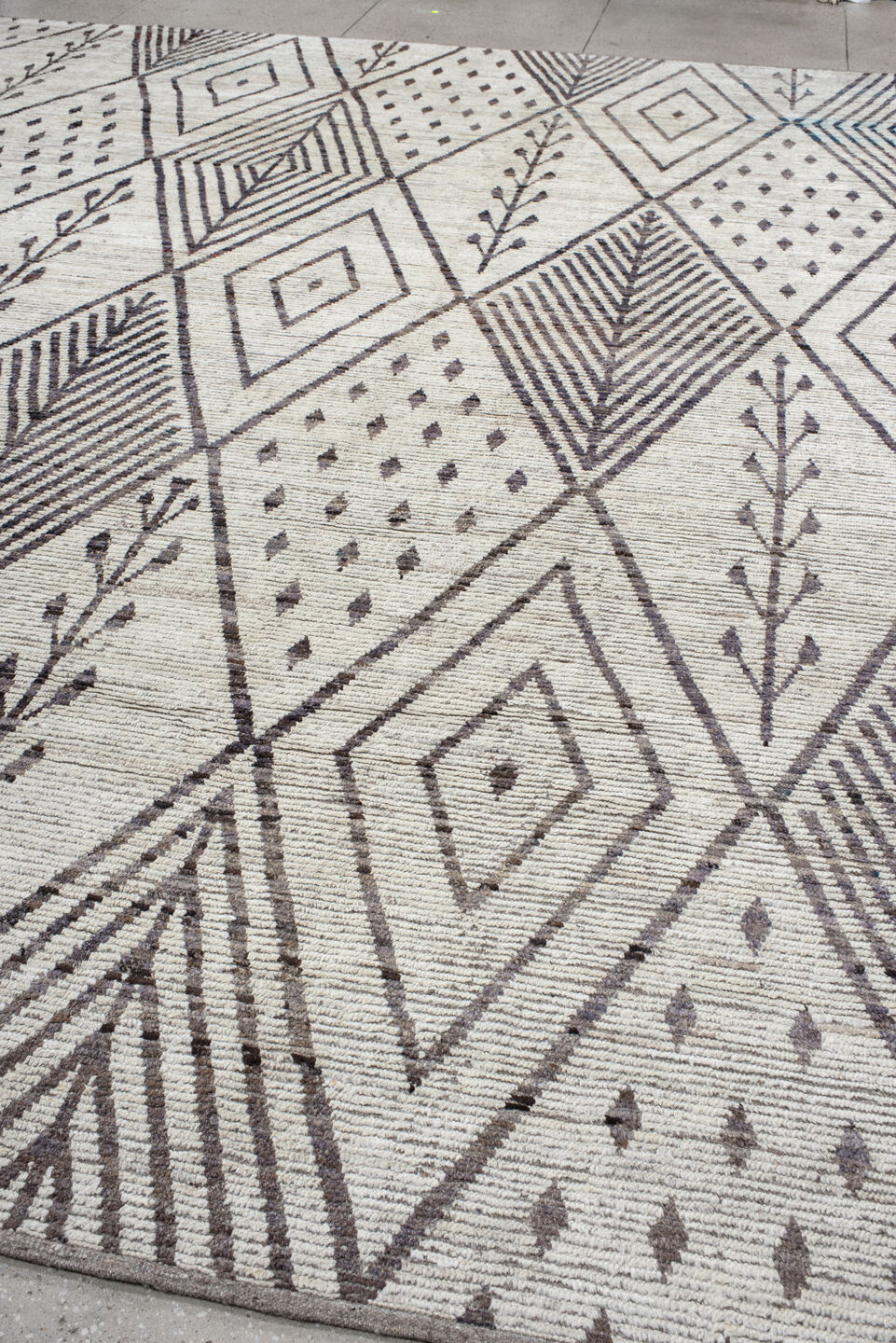 12' x 15' one-of-a-kind handmade vintage Tulu oversize rug. Color palette: ivory, charcoal, taupe, brown, gray, black, beige