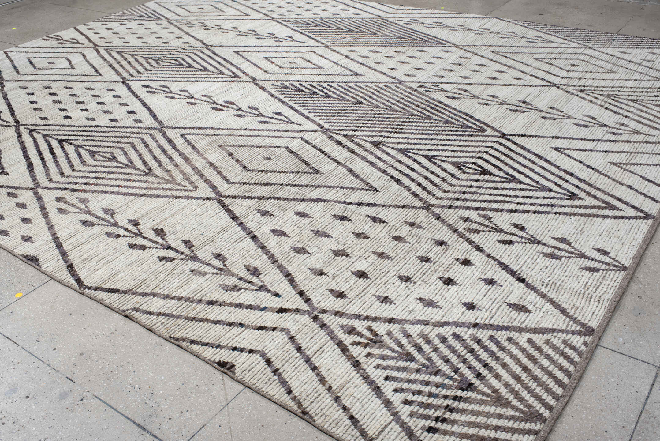 12' x 15' one-of-a-kind handmade vintage Tulu oversize rug. Color palette: ivory, charcoal, taupe, brown, gray, black, beige
