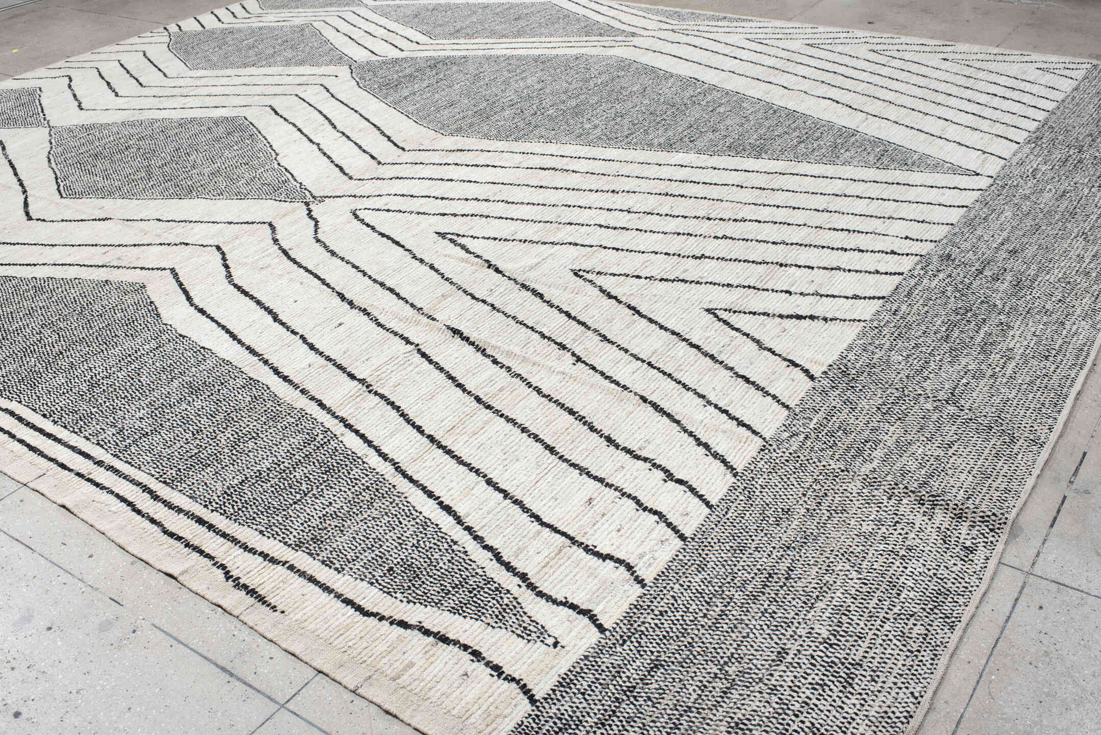 13' x 15' one-of-a-kind handmade vintage Tulu oversize rug. Color palette: ivory, charcoal, gray, black