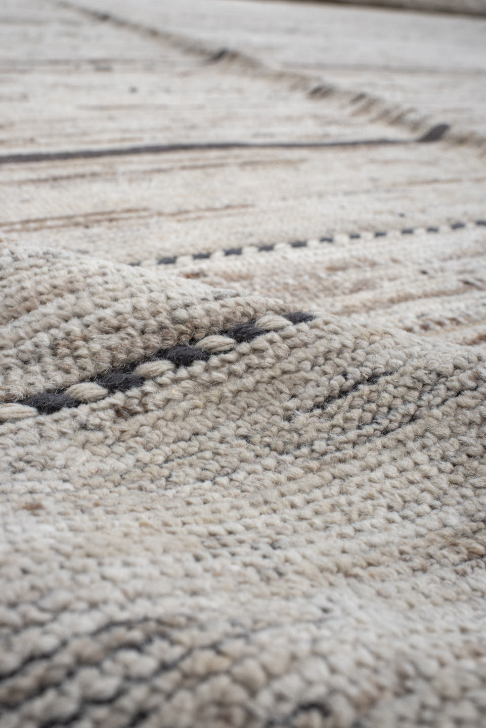 19' x 28' one-of-a-kind handmade vintage Tulu oversize rug. Color palette: ivory, charcoal, taupe, brown, gray, black, beige