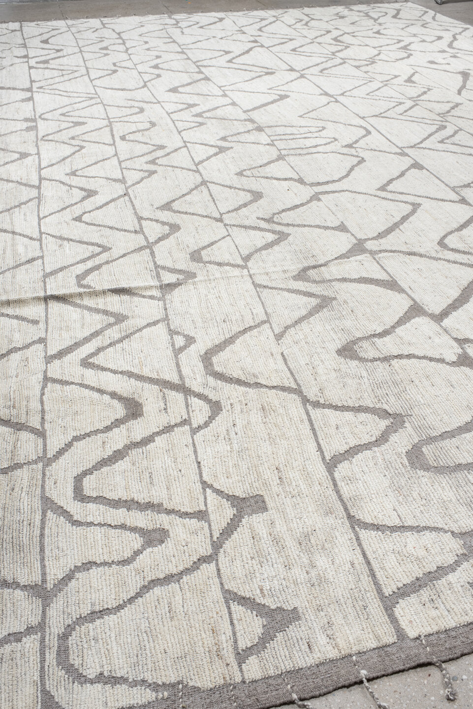 20' x 24' one-of-a-kind handmade vintage Tulu oversize rug. Color palette: ivory, gray, taupe, beige