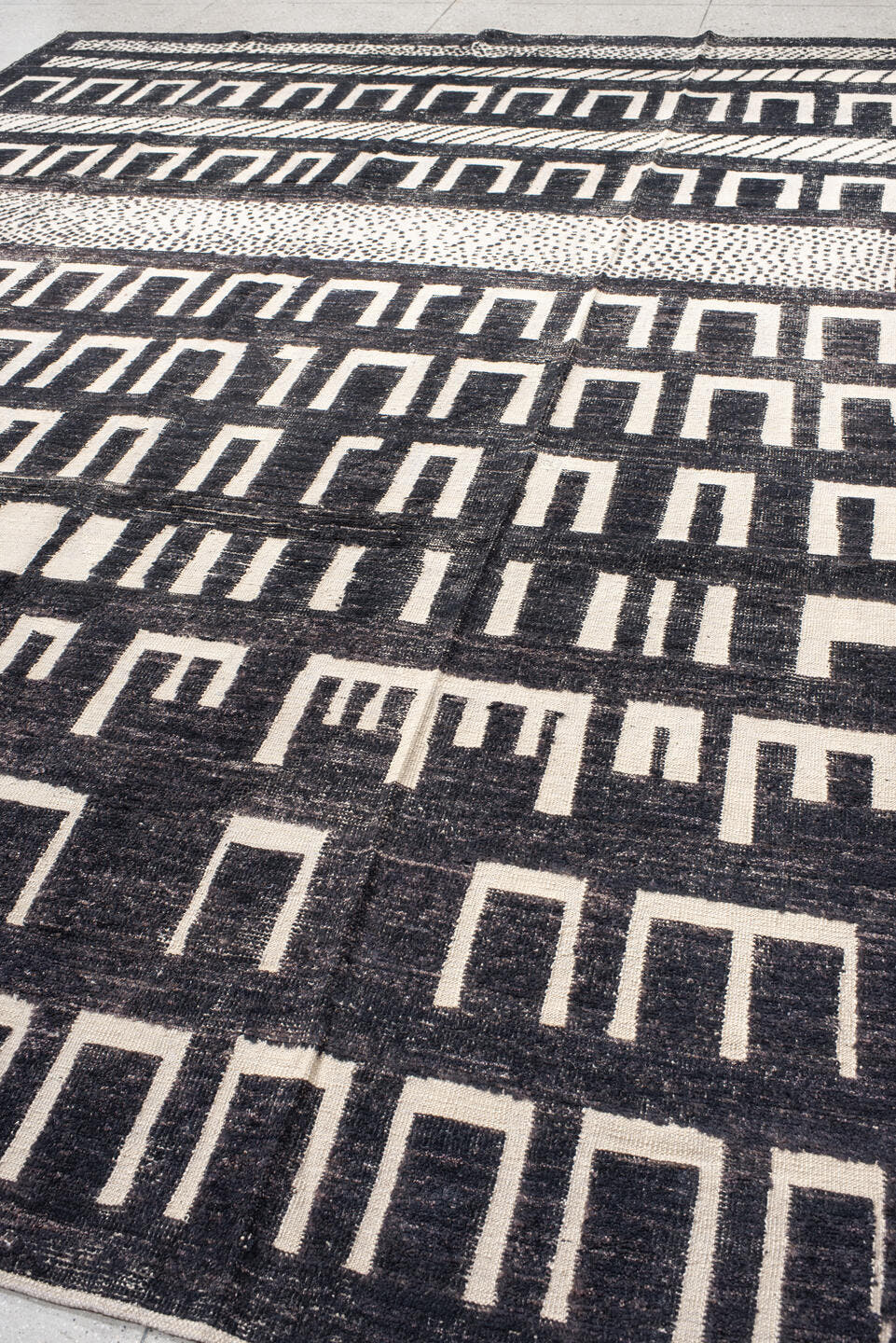 9' x 12' one-of-a-kind handmade vintage Tulu large size rug. Color palette: charcoal, ivory, gray, black