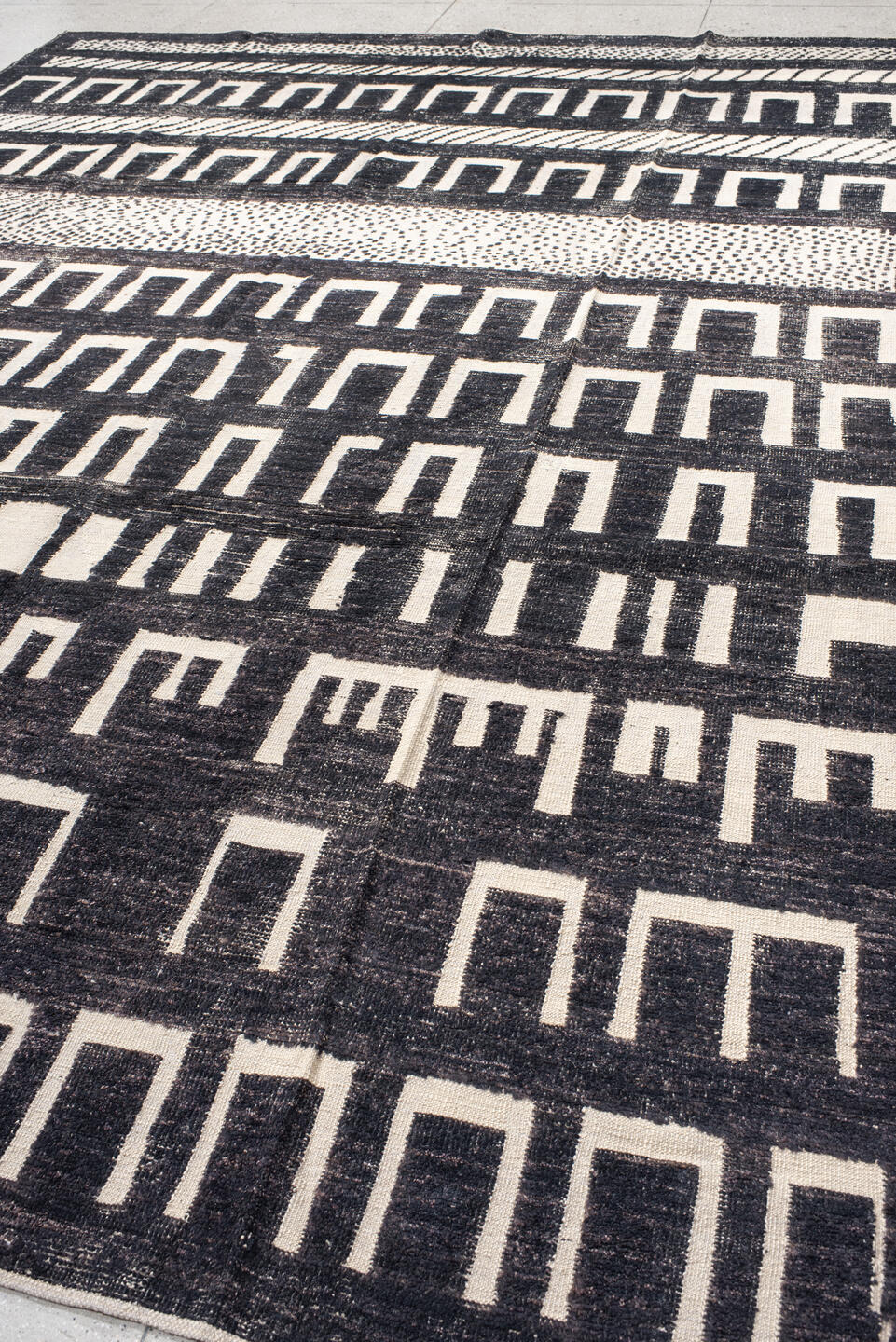 9' x 12' one-of-a-kind handmade vintage Tulu large size rug. Color palette: charcoal, ivory, gray, black