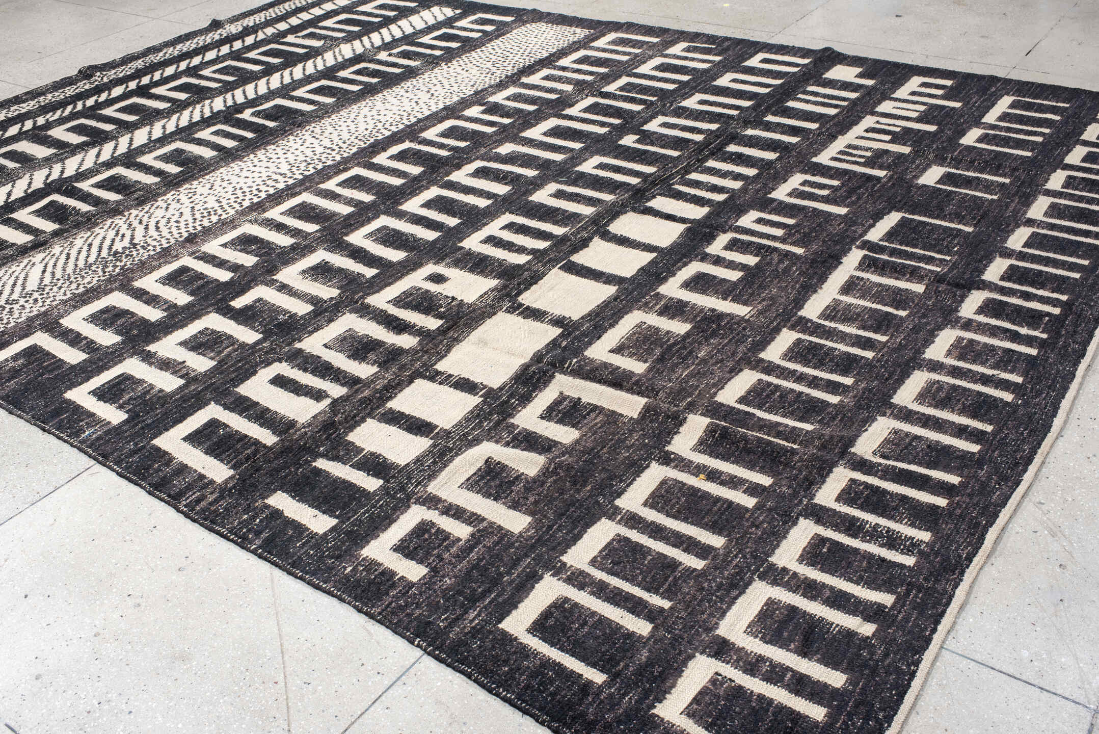 9' x 12' one-of-a-kind handmade vintage Tulu large size rug. Color palette: charcoal, ivory, gray, black