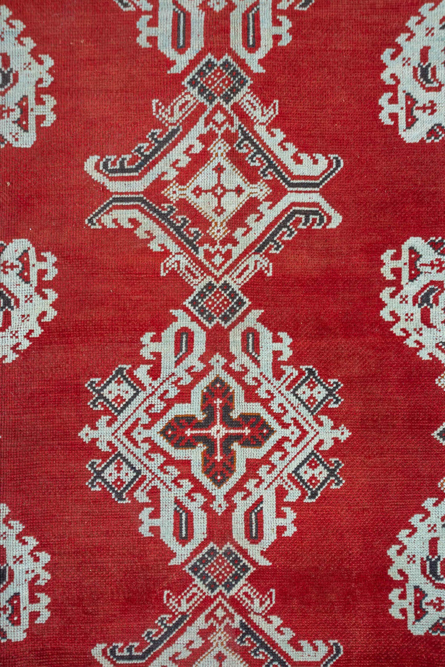 3' x 11' one-of-a-kind handmade vintage Tulu runner rug. Color palette: terracotta, ivory, crimson, charcoal, brown, red