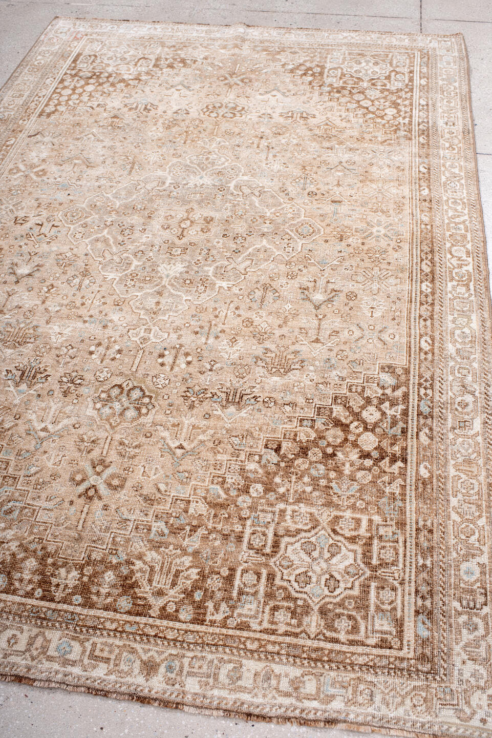 5' x 8' one-of-a-kind handmade vintage Shiraz medium size rug. Color palette: taupe, ivory, camel, beige, light brown