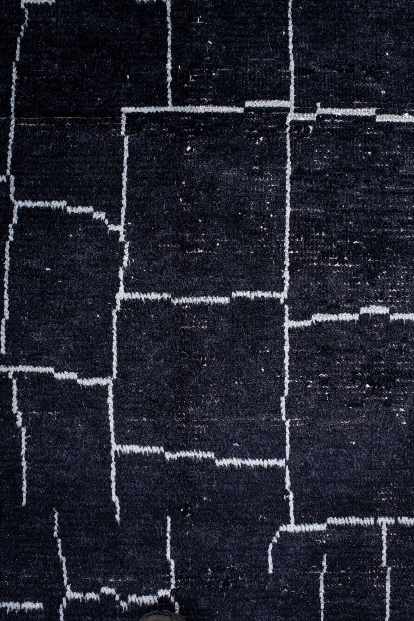 7' x 9' one-of-a-kind handmade vintage Moroccan rug. Color palette: black, ivory