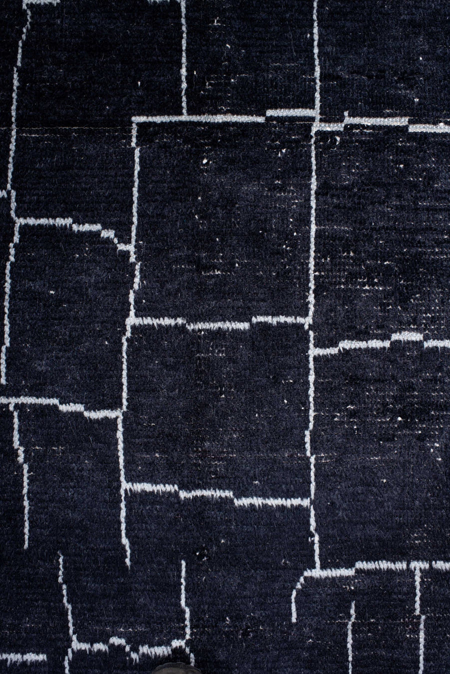 7' x 9' one-of-a-kind handmade vintage Moroccan rug. Color palette: black, ivory
