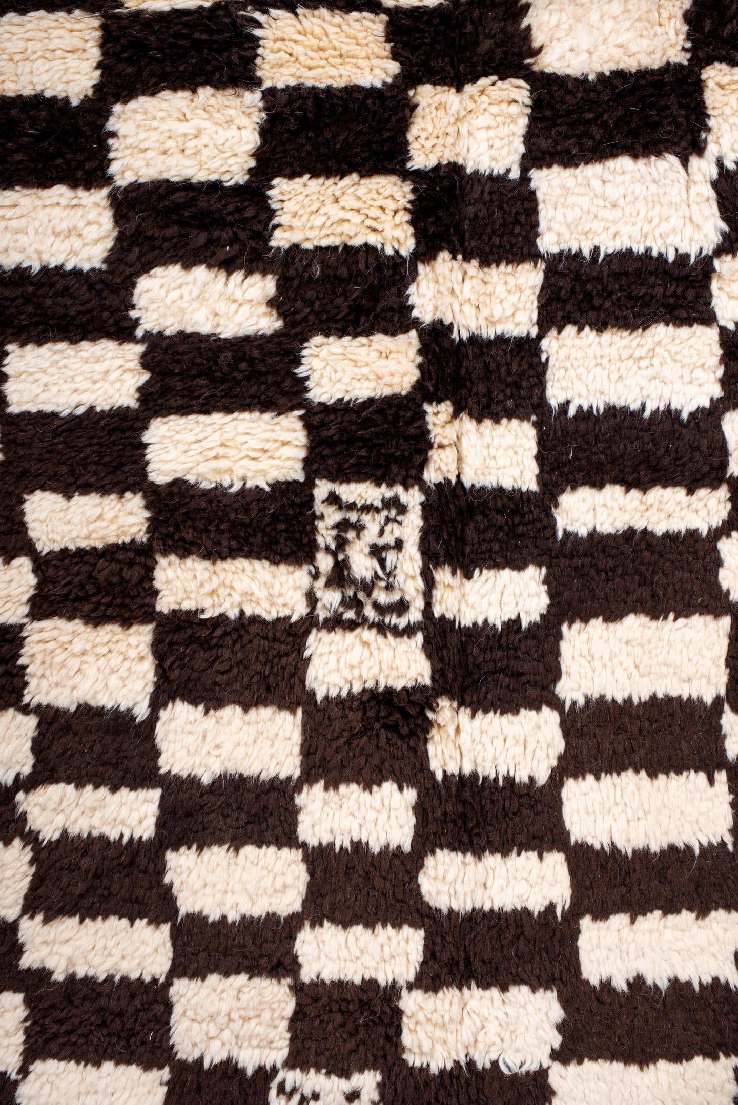 7' x 9' one-of-a-kind handmade vintage Moroccan rug. Color palette: ivory, brown, black, cream
