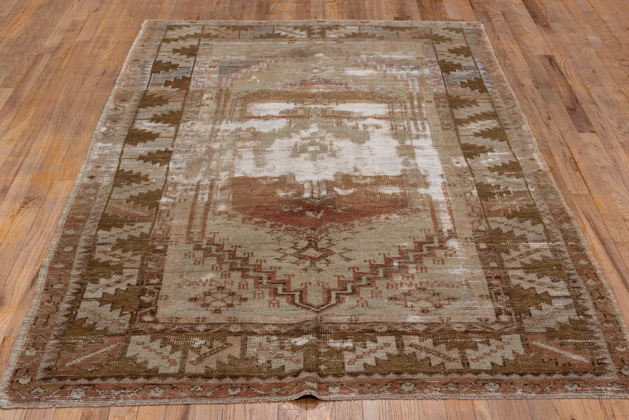 4' x 8' one-of-a-kind handmade vintage Oushak rug. Color palette: brown, gray, light gray, off-white, pink