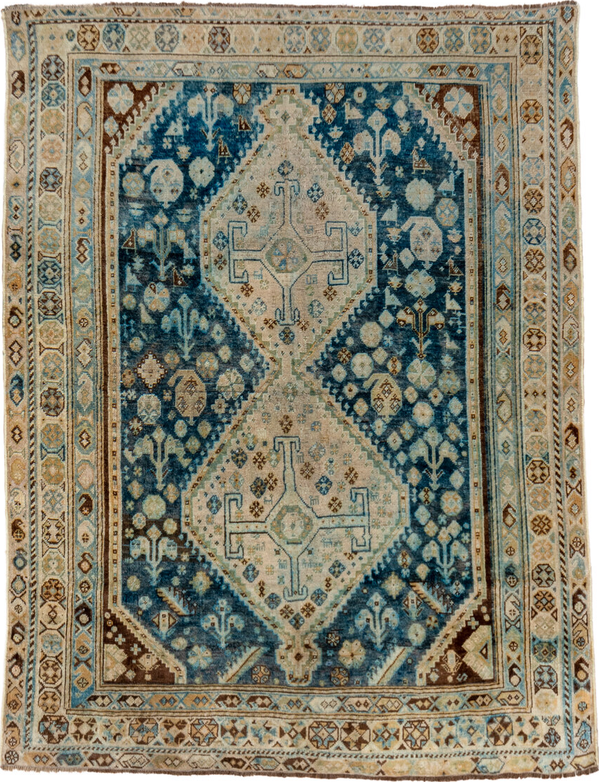 4' x 5' one-of-a-kind handmade vintage Shiraz small size rug. Color palette: blue, brown, gray, light gray, off-white