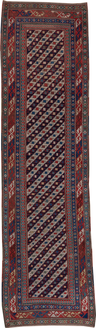 3' x 12' one-of-a-kind handmade vintage Genje runner rug. Color palette: black, blue, brown, gray, pink, red