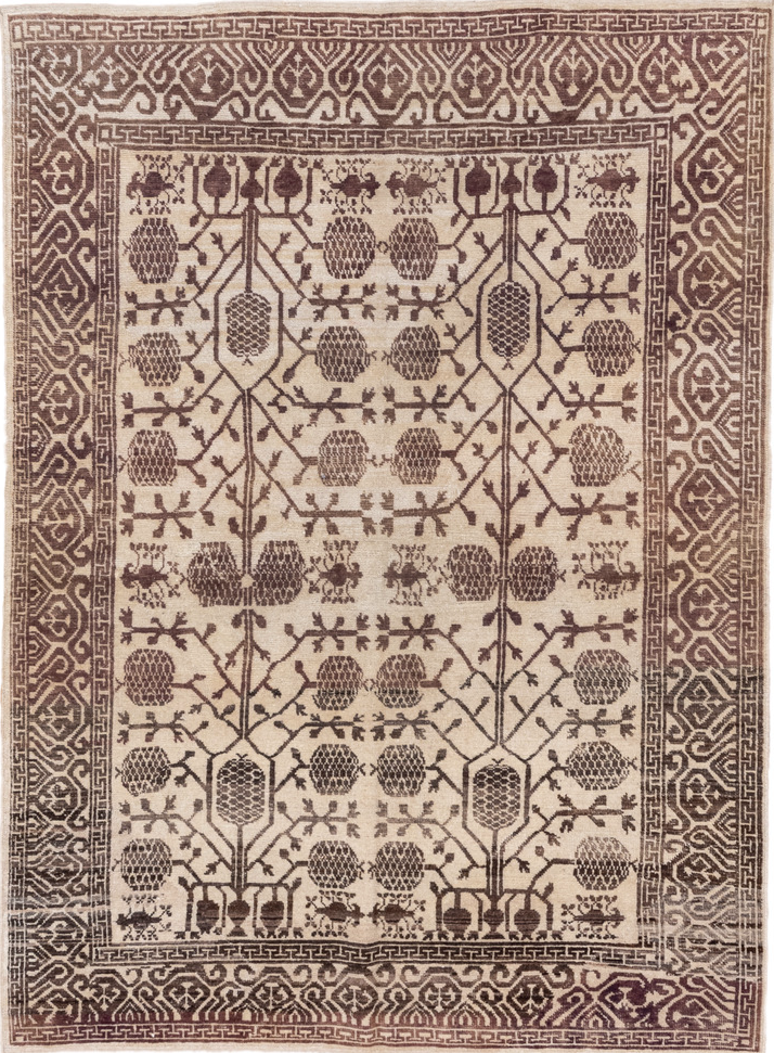5' x 7' one-of-a-kind handmade vintage Tulu rug. Color palette: brown, gray, light gray, off-white, orange, pink
