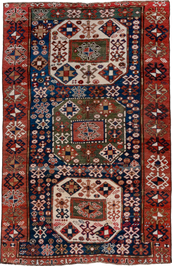4' x 6' one-of-a-kind handmade vintage Kazak small size rug. Color palette: blue, brown, gray, pink, red