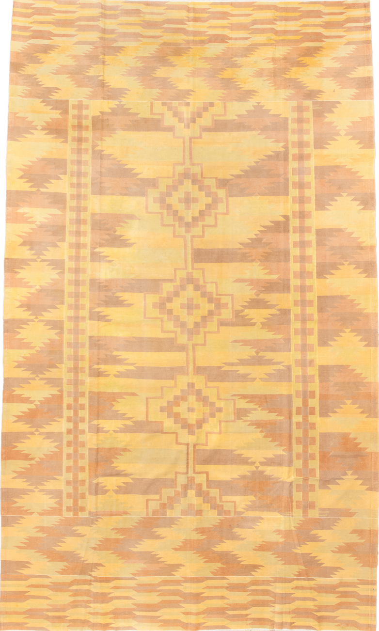 9' x 16' one-of-a-kind handmade vintage Dhurrie rug. Color palette: brown, yellow, orange, off-white, pink, navajo white