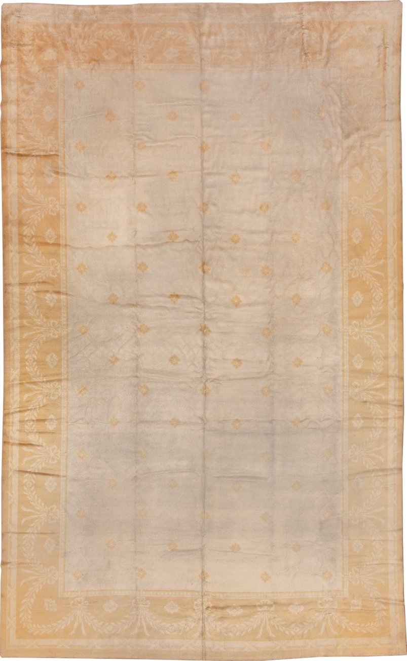 10' x 17' one-of-a-kind handmade vintage Savonnerie rug. Color palette: brown, gray, off-white, orange, pink, tan