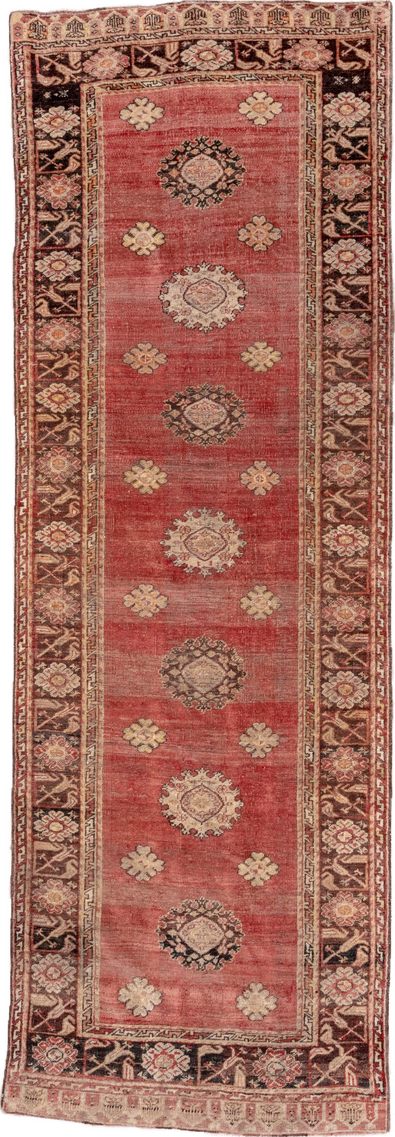 3' x 11' one-of-a-kind handmade vintage Oushak runner rug. Color palette: brown, orange, pink, red, redwood