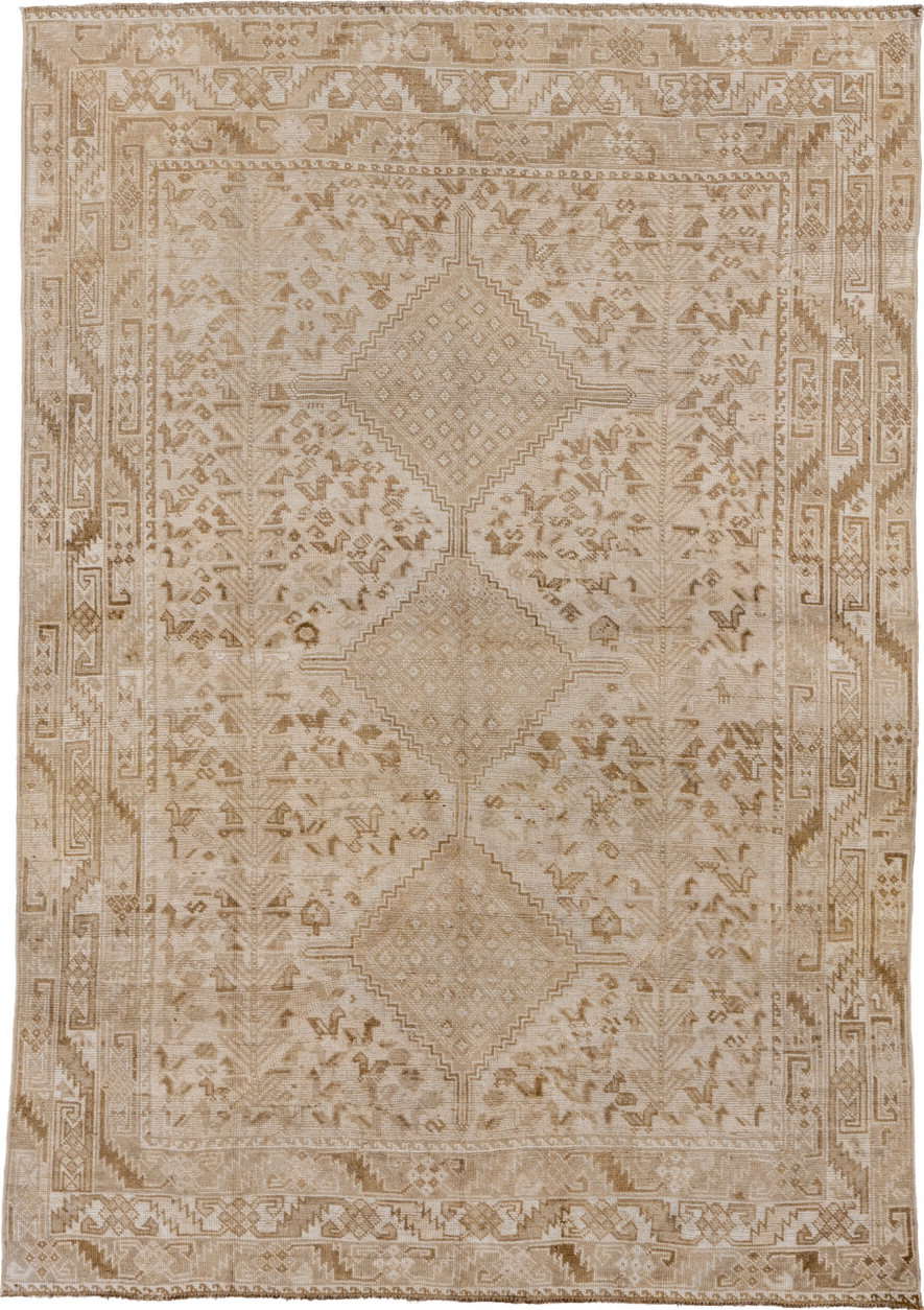 5' x 8' one-of-a-kind handmade vintage Shiraz medium size rug. Color palette: brown, gray, light gray, off-white, pink, snow