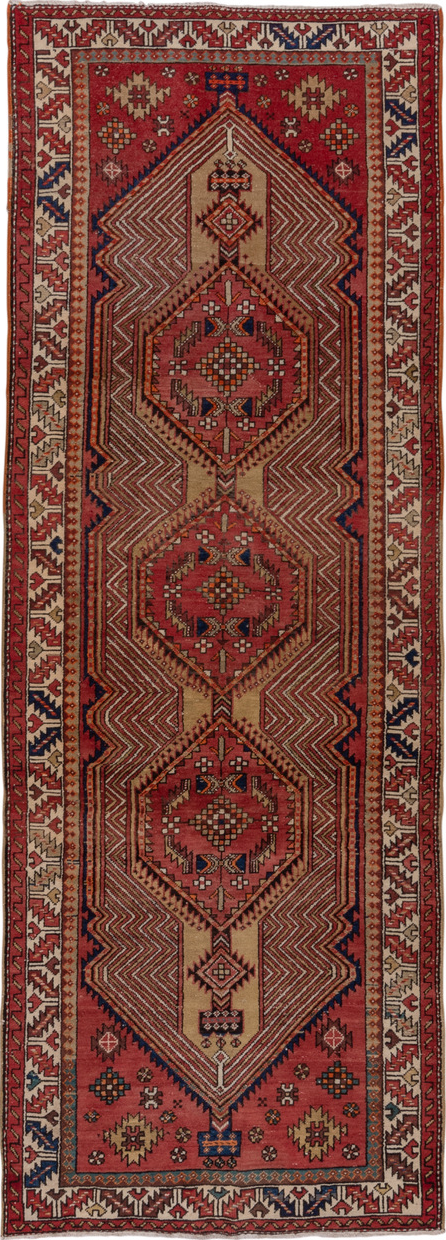 4' x 11' one-of-a-kind handmade vintage Sarab runner rug. Color palette: brown, gray, pink, red