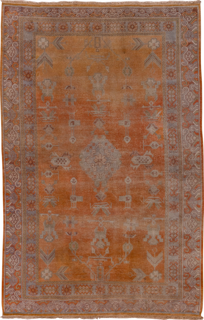 5' x 9' one-of-a-kind handmade vintage Khotan medium size rug. Color palette: brown, light gray, off-white, pink