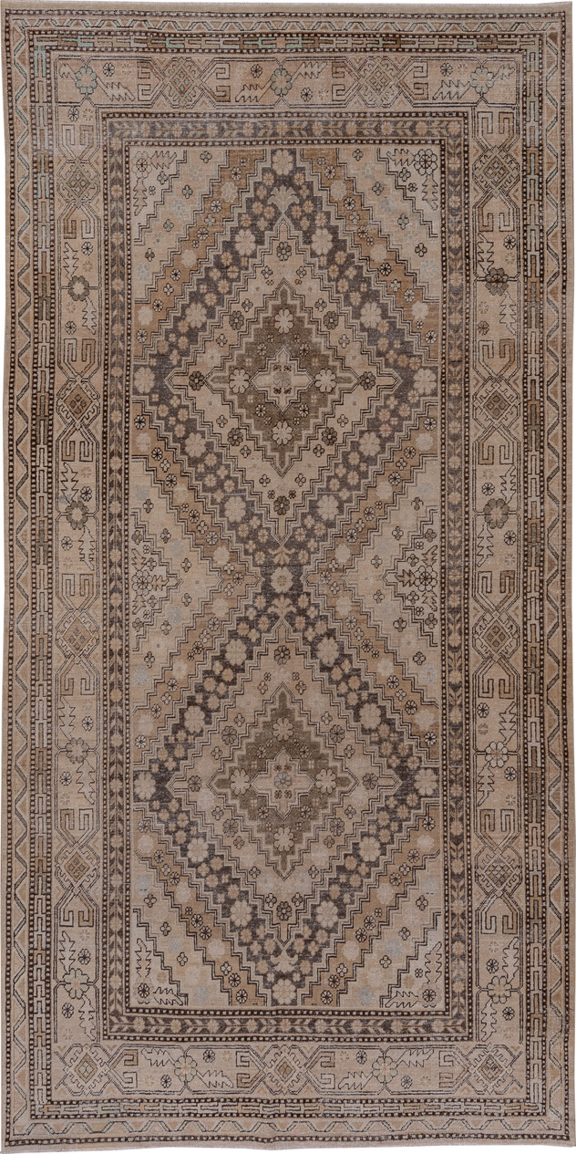 5' x 11' one-of-a-kind handmade vintage Khotan rug. Color palette: brown, gray, light gray, off-white, pink