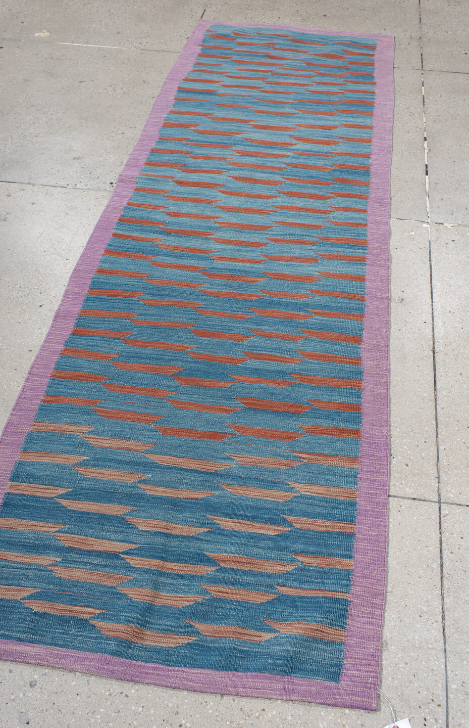 2' x 8' one-of-a-kind handmade vintage Kilim runner rug. Color palette: pink, blue, gray, light gray, light blue, brown, red