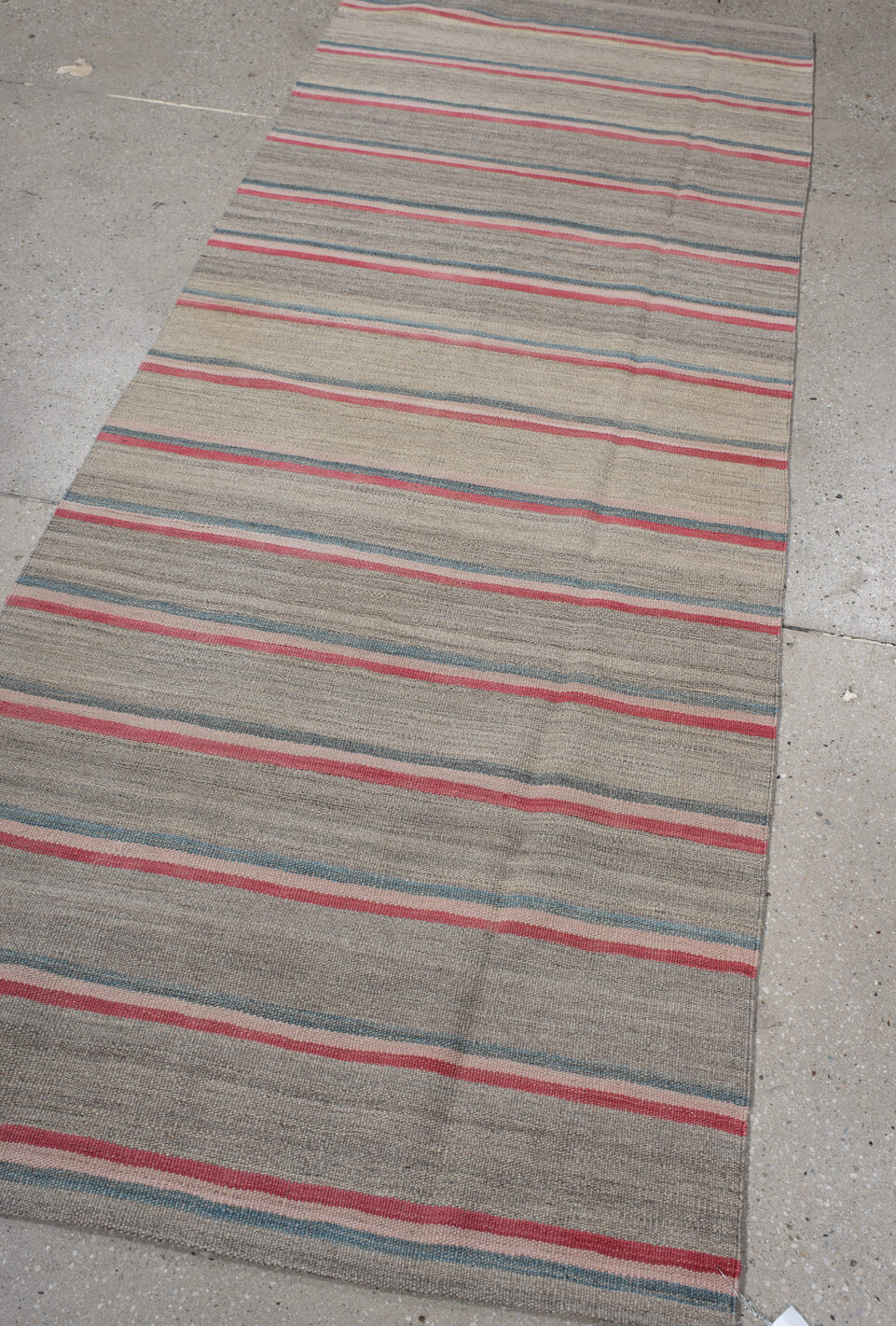 2' x 7' one-of-a-kind handmade vintage Kilim runner rug. Color palette: black, brown, dark gray, gray, light gray, pink, red