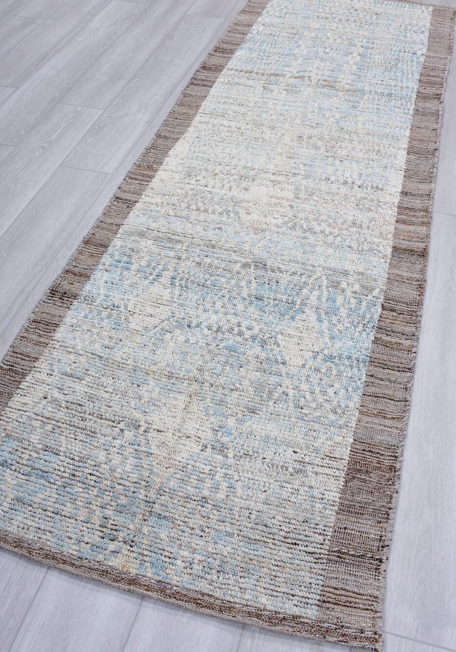 3' x 9' one-of-a-kind handmade vintage Tulu runner rug. Color palette: gray, light gray, off-white, light blue, blue