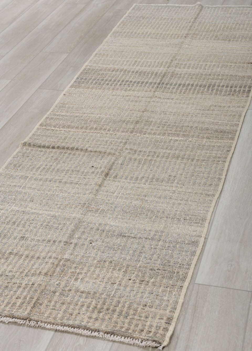 3' x 9' one-of-a-kind handmade vintage Tulu runner rug. Color palette: gray, light gray, off-white, silver