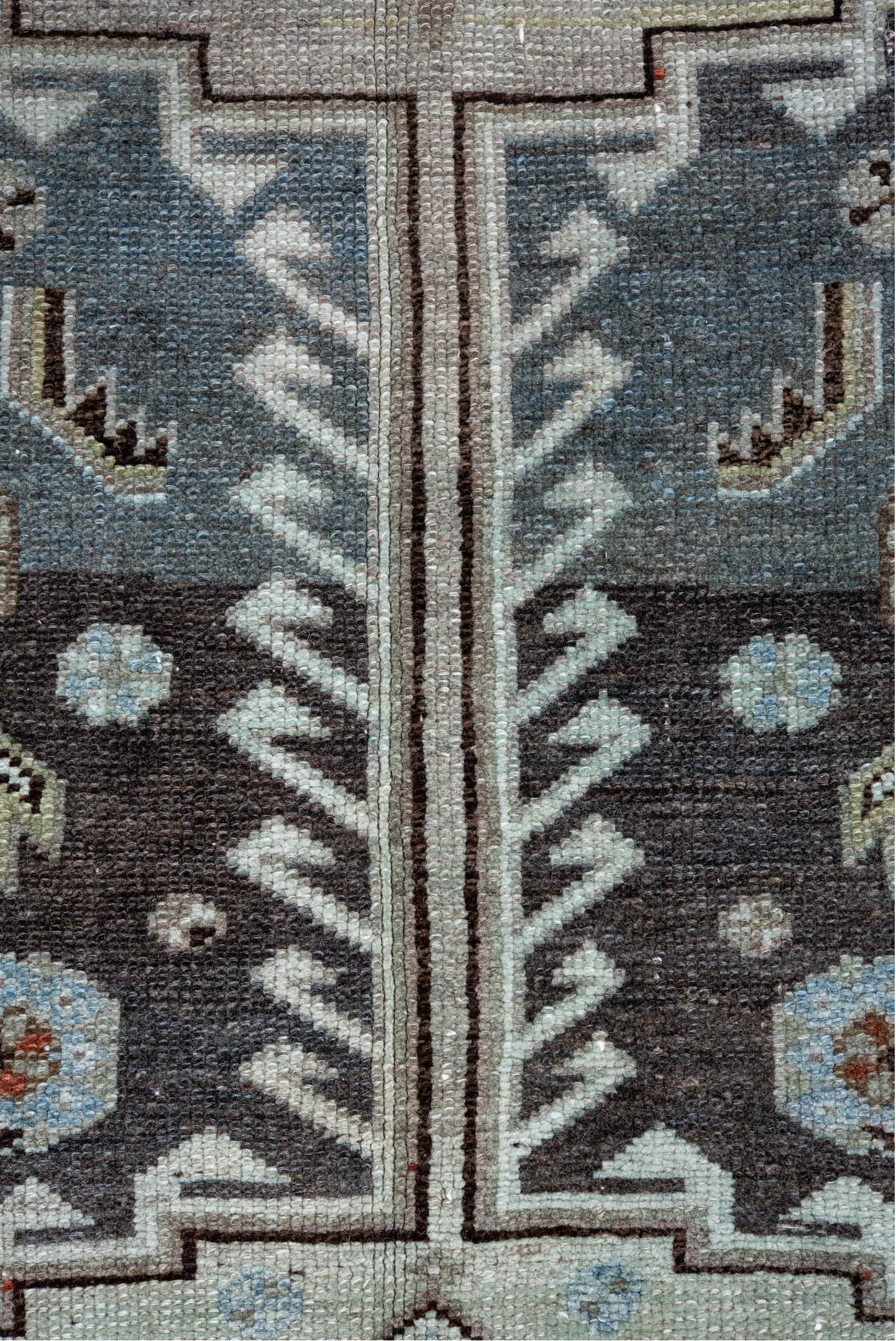 4' x 10' one-of-a-kind handmade vintage Kurd runner rug. Color palette: black, blue, brown, charcoal, dark gray, gray