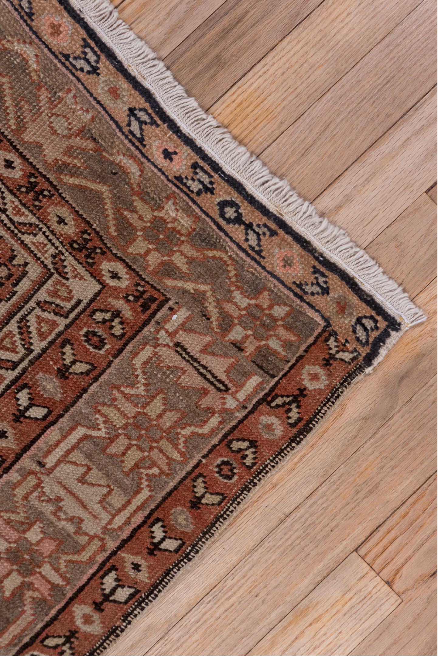 4' x 5' one-of-a-kind handmade vintage Serapi small size rug. Color palette: brown, gray, pink, red, redwood