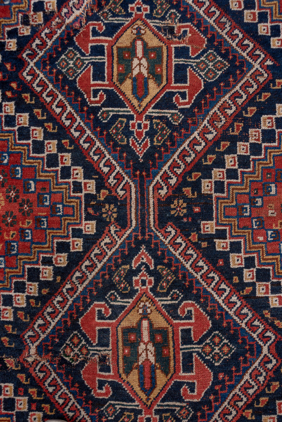 3' x 9' one-of-a-kind handmade vintage Shiraz runner rug. Color palette: black, blue, brown, fiord, gray, pink, red
