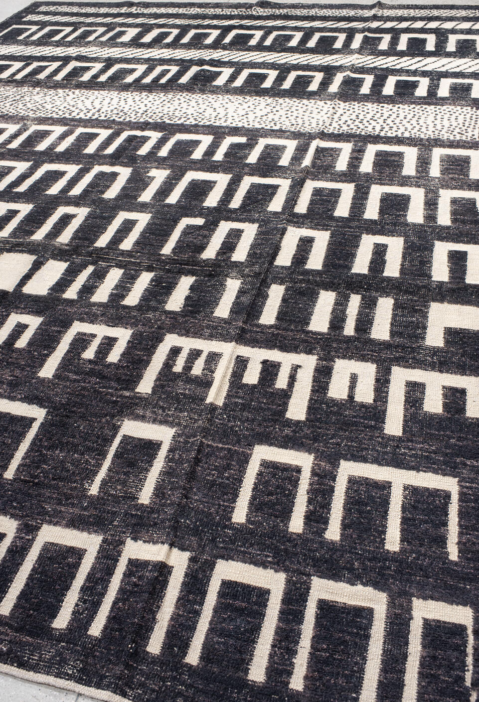 9' x 12' one-of-a-kind handmade vintage Tulu large size rug. Color palette: gray, black, off-white, pink, light gray, blue