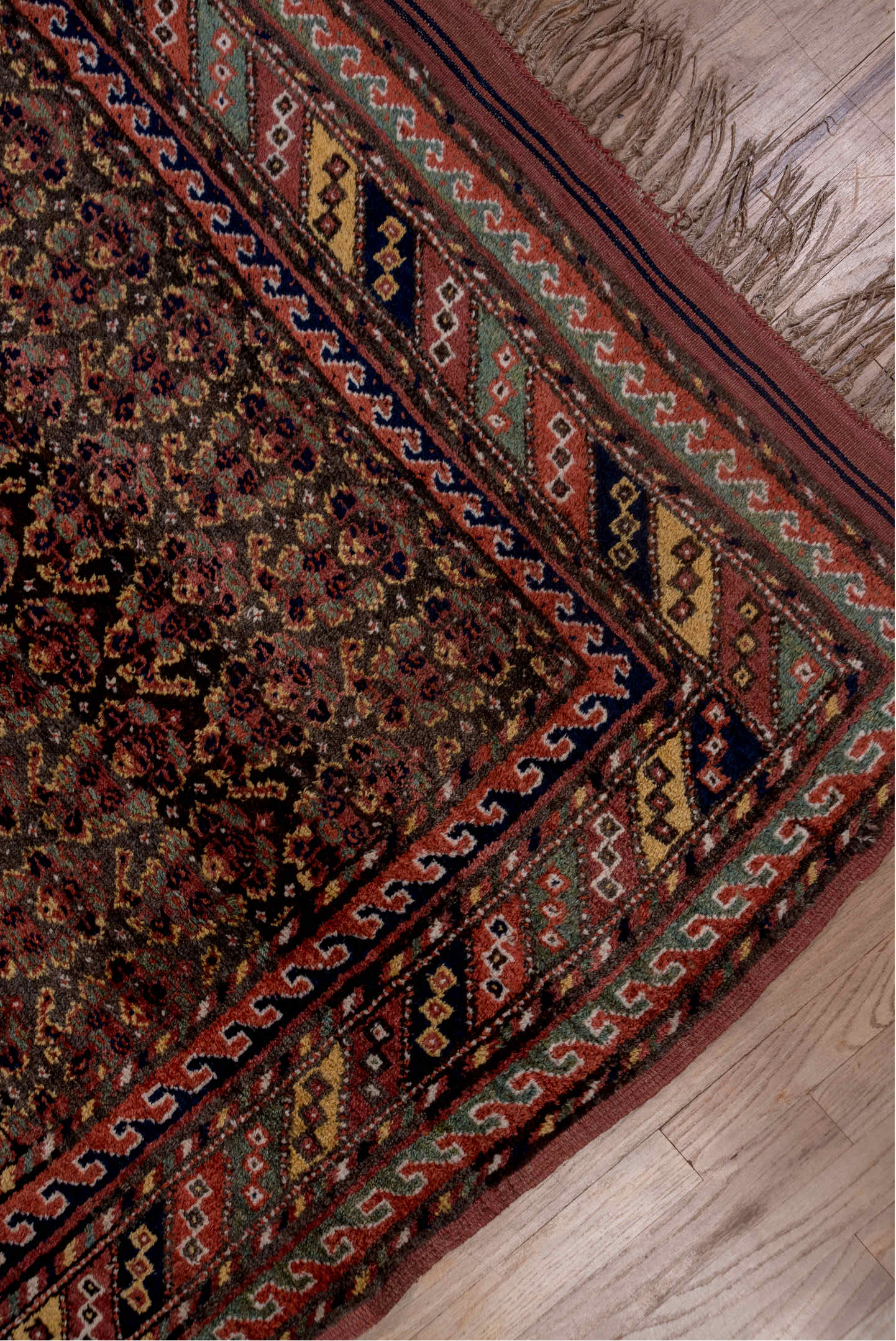 4' x 9' one-of-a-kind handmade vintage Kurd rug. Color palette: brown, dark gray, gray, light gray, off-white, pink, red