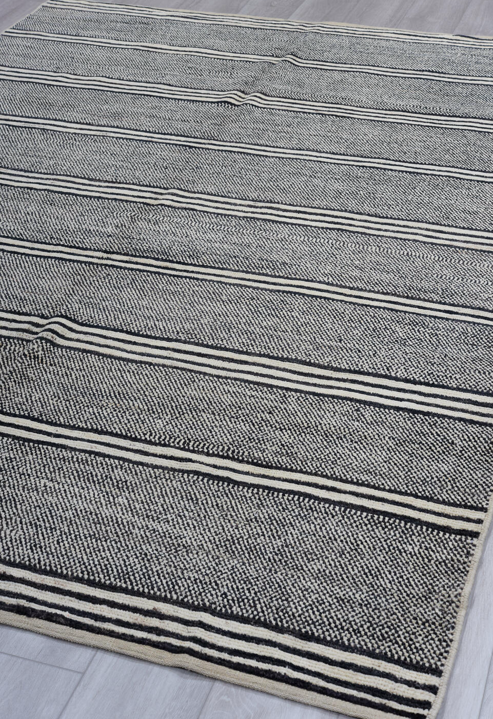 6' x 9' one-of-a-kind handmade vintage Tulu medium size rug. Color palette: black, blue, charcoal, dark gray, dim gray