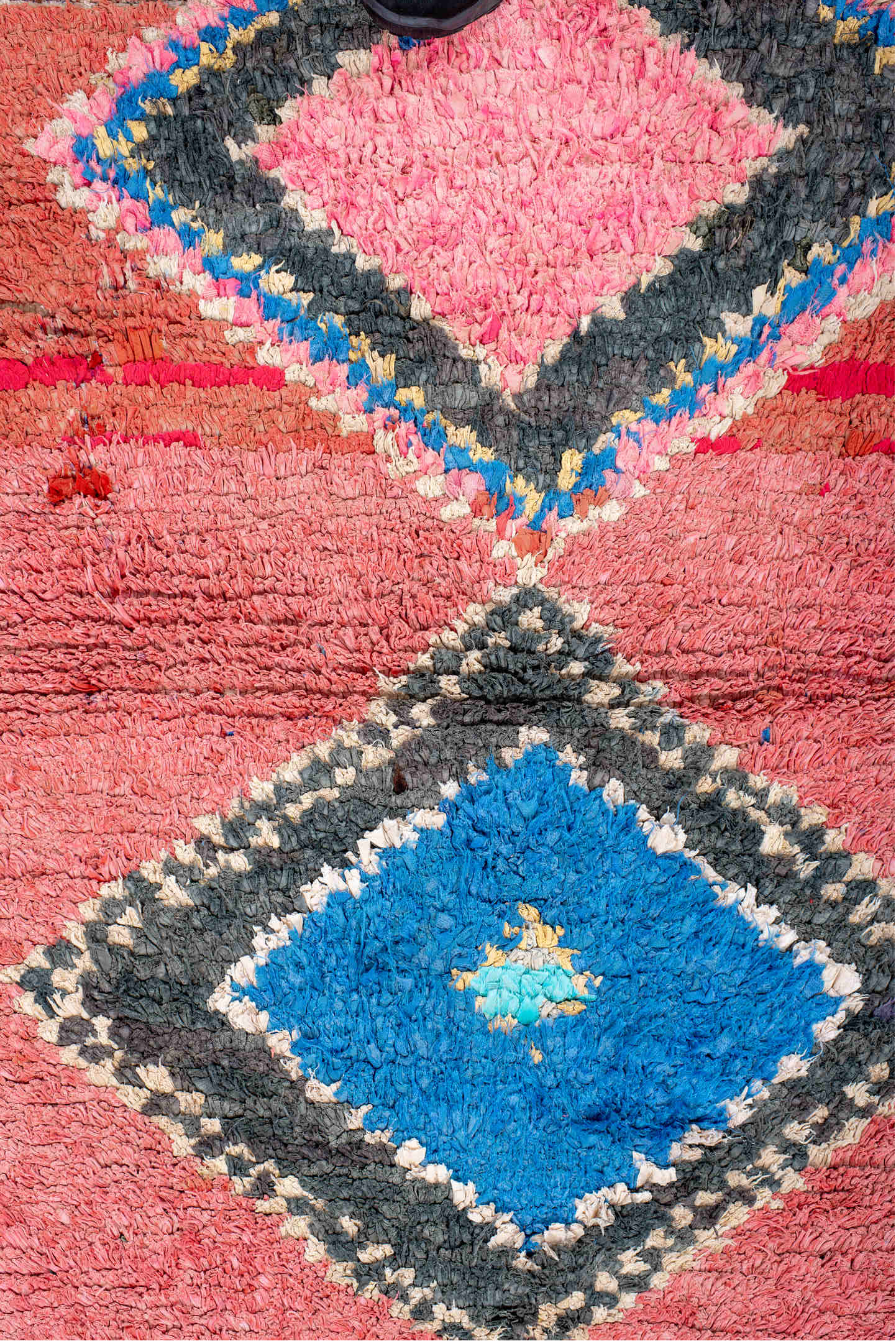 3' x 4' one-of-a-kind handmade vintage Rag Rug small size rug. Color palette: black, blue, brown, charcoal, crimson