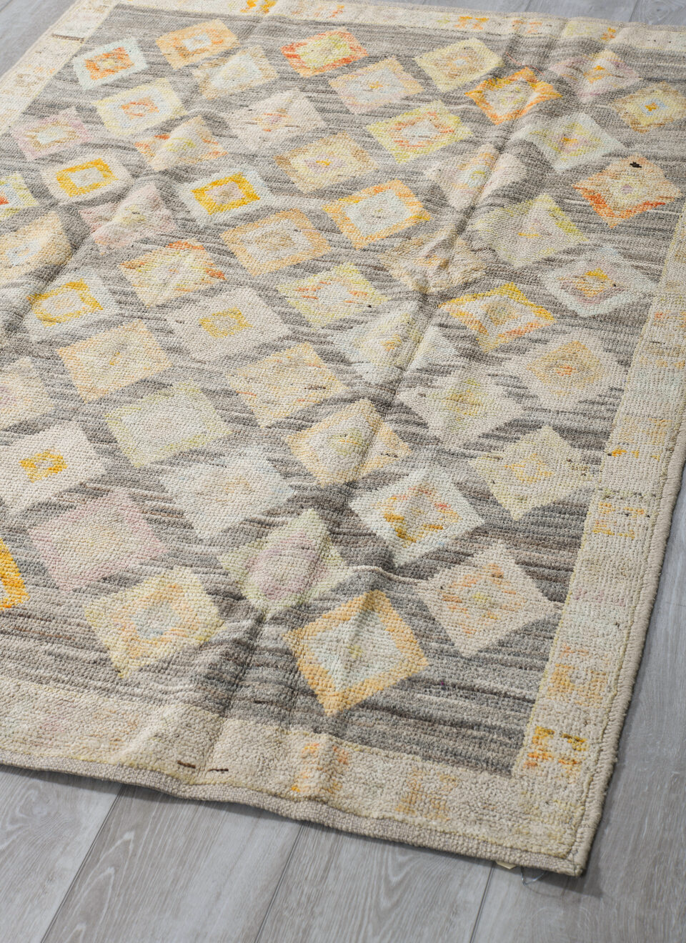 4' x 6' one-of-a-kind handmade vintage Tulu small size rug. Color palette: brown, gray, light gray, off-white, orange, tan