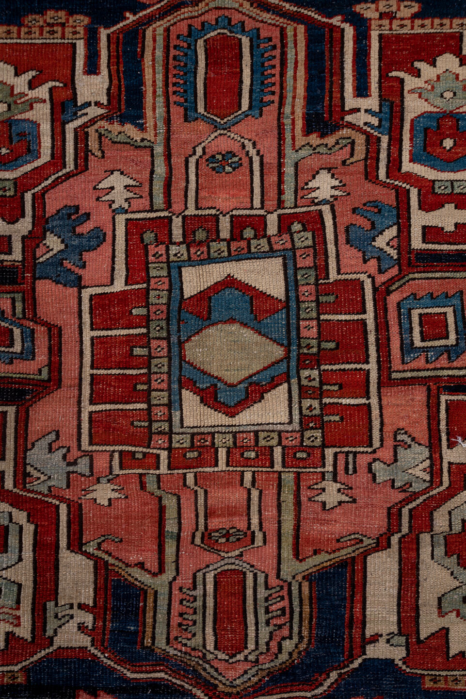 9' x 12' one-of-a-kind handmade vintage Serapi large size rug. Color palette: black, blue, brown, gray, pink, red