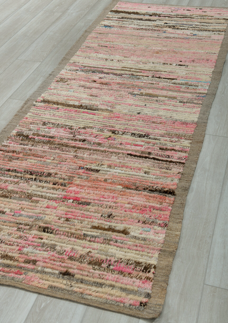 3' x 9' one-of-a-kind handmade vintage Tulu runner rug. Color palette: brown, gray, light gray, off-white, pink, red