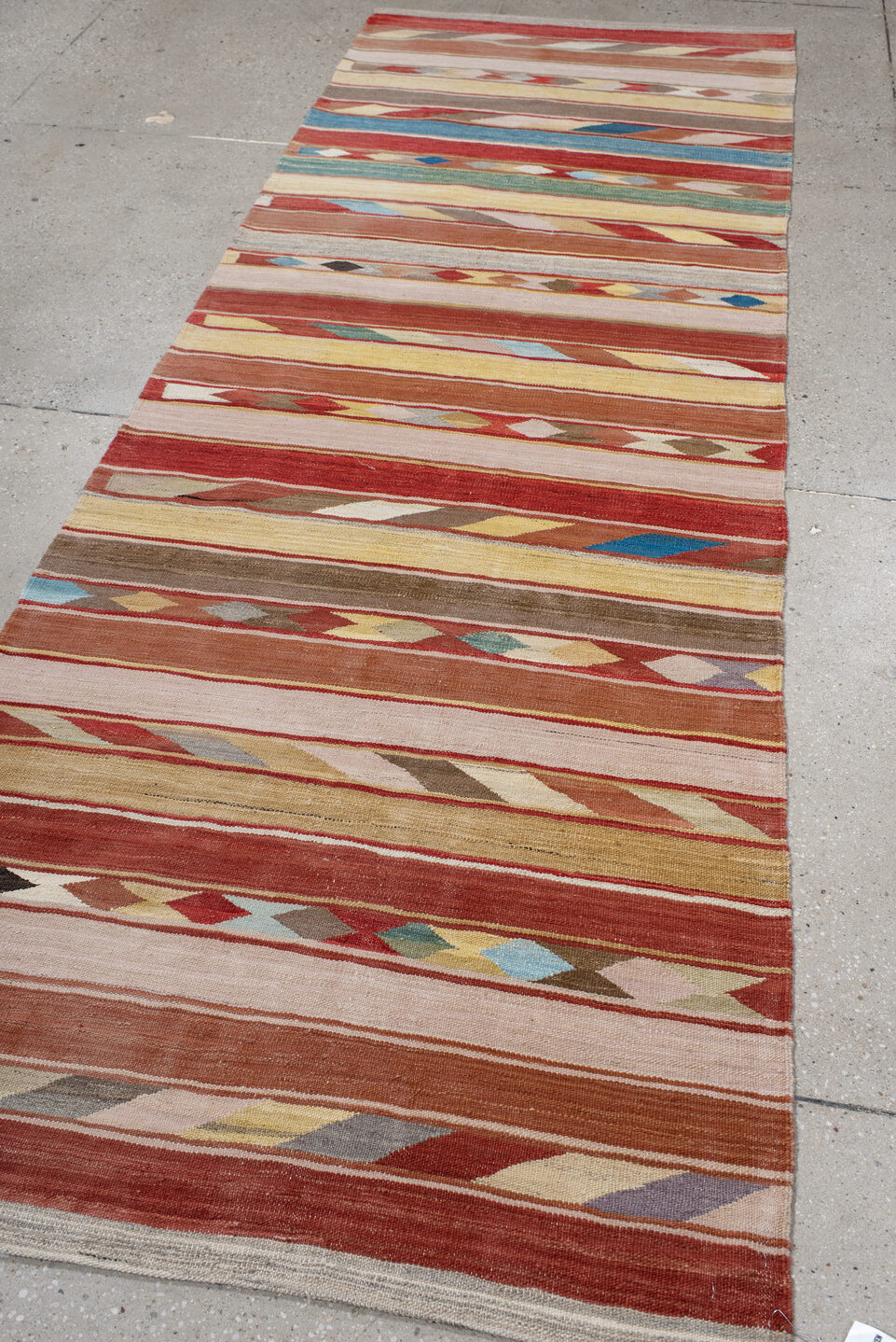 3' x 9' one-of-a-kind handmade vintage Kilim runner rug. Color palette: gray, blue, brown, pink, light gray, off-white